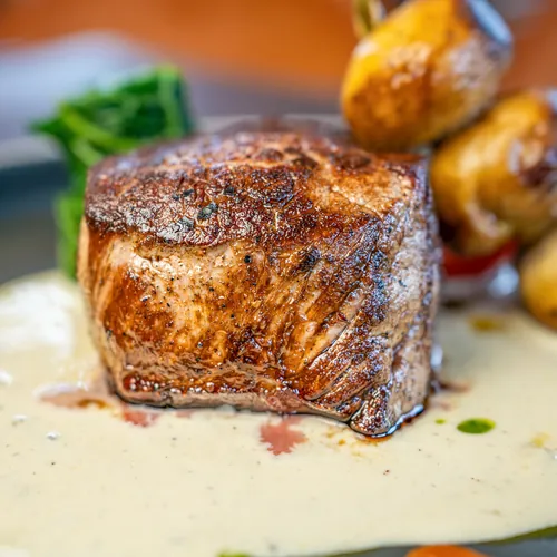 Seared fillet steak with roasted potatoes and cream sauce at Bella Vista, Bristol